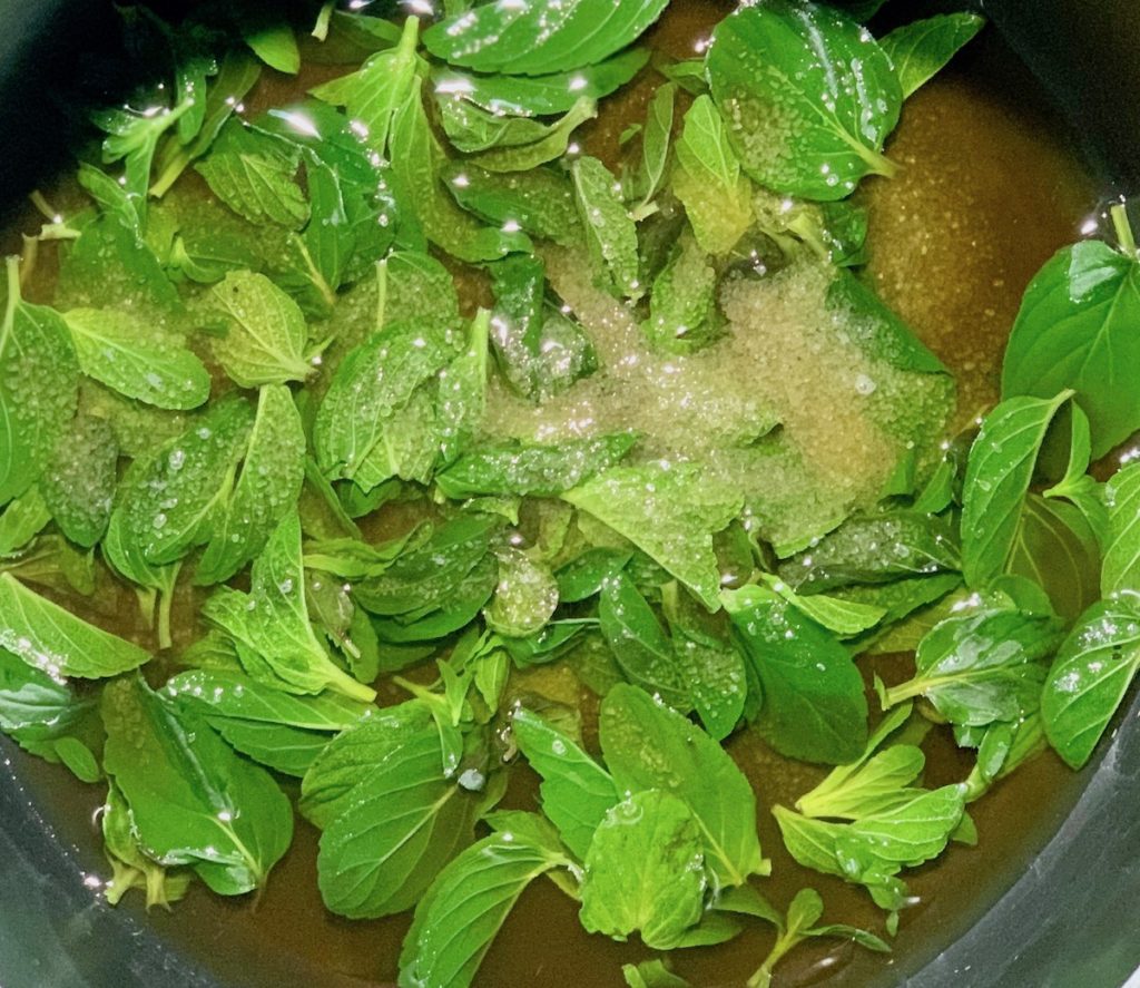 Mint leaves simmering with sugar